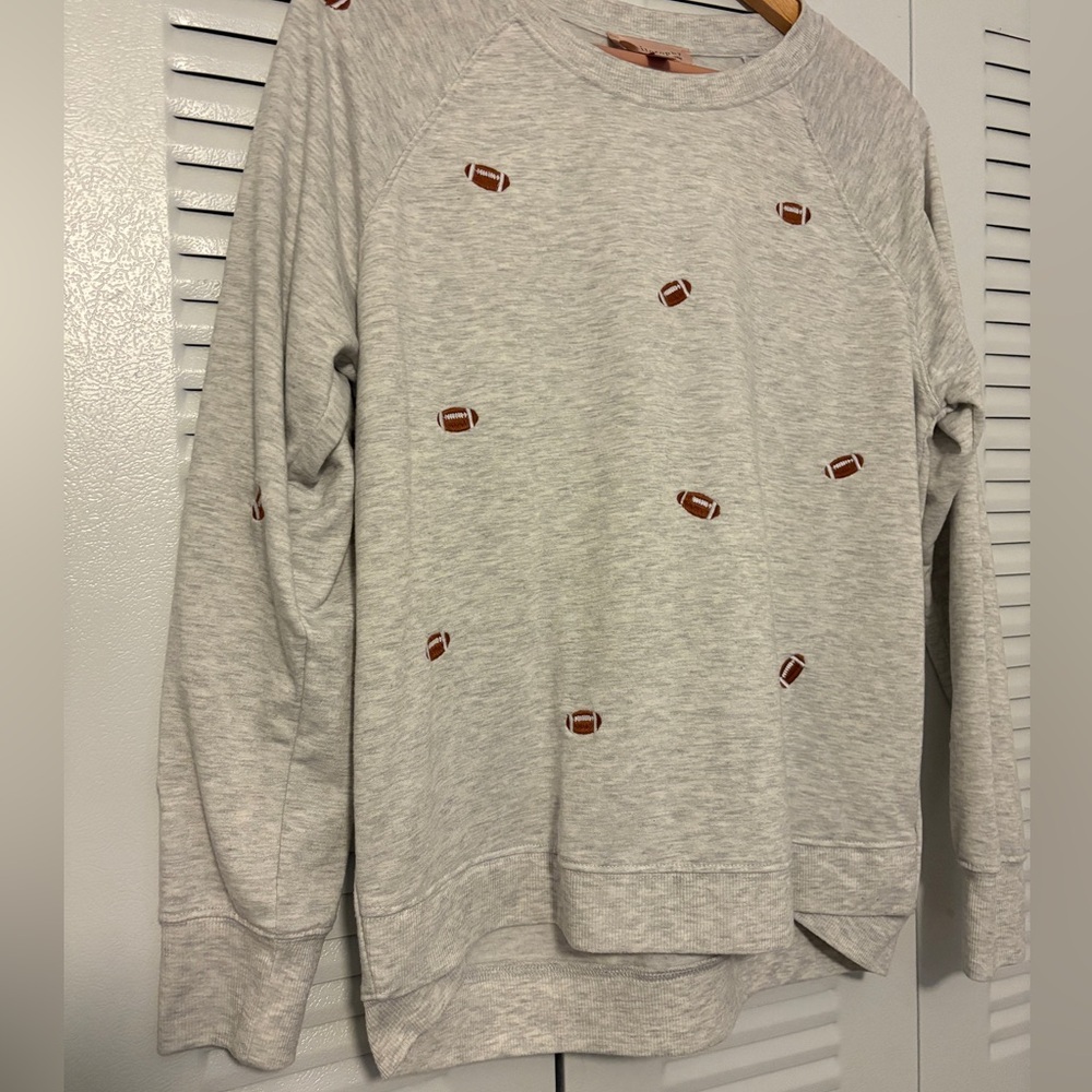 Used once Cute sweater with embroidered football.